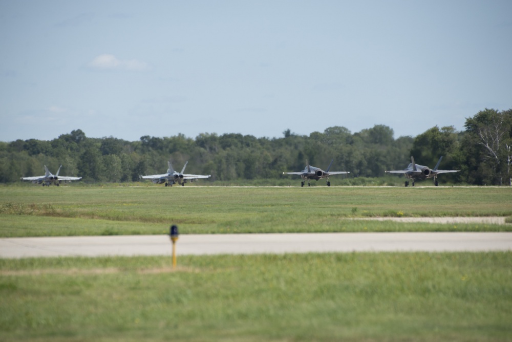 132nd Electronic Attack Squadron EA-18 Growlers and 33rd Fighter Wing F-35As taxi down the flightline during Northern Lightning Aug. 22, 2016, at Volk Field, Wis. (U.S. Air Force photo by Senior Airman Stormy Archer)