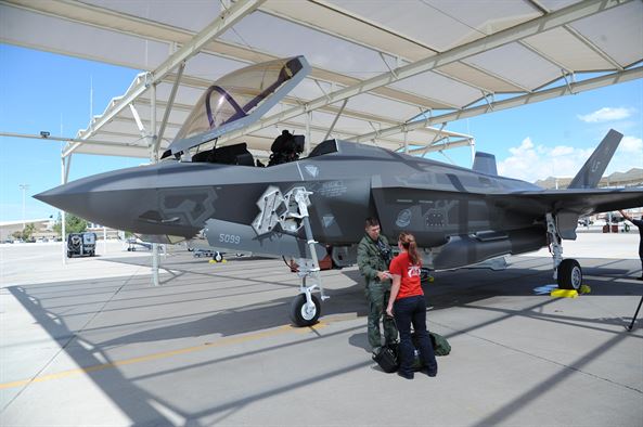 Maj.Matt Strongin, 62nd Fighter Squadron F-35 Lightning II pilot, is met by a 62nd Aircraft Maintenance Unit Airman Aug. 26, 2016, after landing the Air Force's 100th F-35. This milestone comes on the heels of the Air Force's announcement of the F-35's initial operational capability. (U.S. Air Force photo by Tech. Sgt. Luther Mitchell Jr)