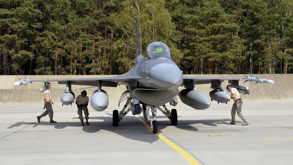 Lask Air Base, Poland -- Members of the South Dakota Air National Guard 114th Maintenance Group immediately begin an initial cursory inspection of an F-16 Fighting Falcon upon arrival here Sept. 3. Additional recovery procedures are then performed after the aircraft is shut down. (U.S. Air National Guard photo by Capt. Amy Rittberger/Released)